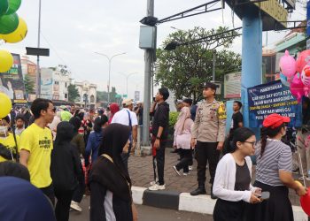 Polsek Pancoran Mas Amankan Kegiatan Car Free Day