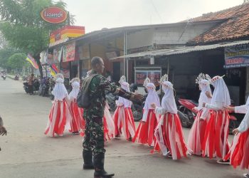 Polsek Tambelang Amankan Jalur Lomba Jalan Sehat Tingkat Kecamatan Tahun 2025