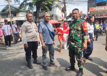 Bhabinkamtibmas Jatinegara Kawal Karnaval HUT ke-80 RI di RW 014 Cakung
